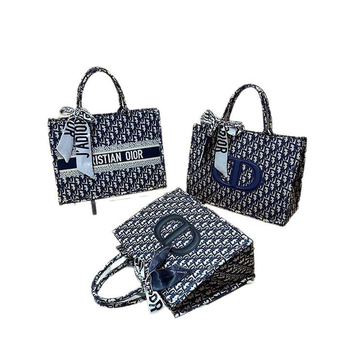 Bolsa grande para mujeres 2025 nueva moda red lienzo rojo de moda bolsa de hombro brazo universal de gran capacidad bolso de mano