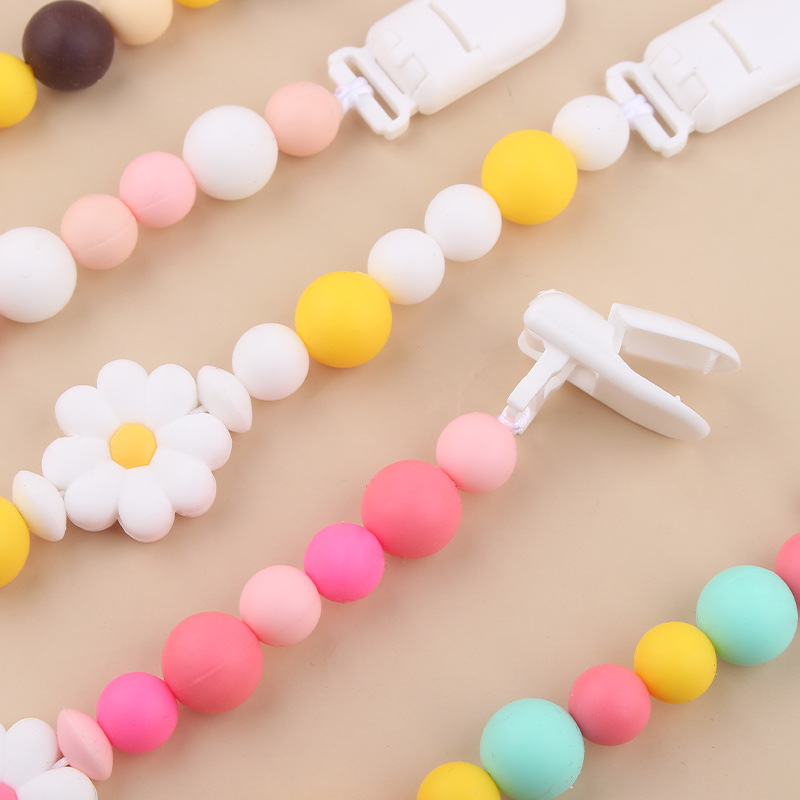 Productos para bebés Clip de chupete de plástico de bricolaje para bebés Creativo para bebés Little Daisy Silicona Mouth Pezones anti-caída de la cadena