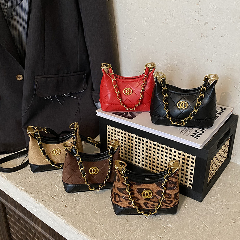 Coreana de alto valor para niños y niñas bolsas de hombro de patrón de leopardo diamante mini bolsas de bebé nuevas bolsas de cadenas para niños