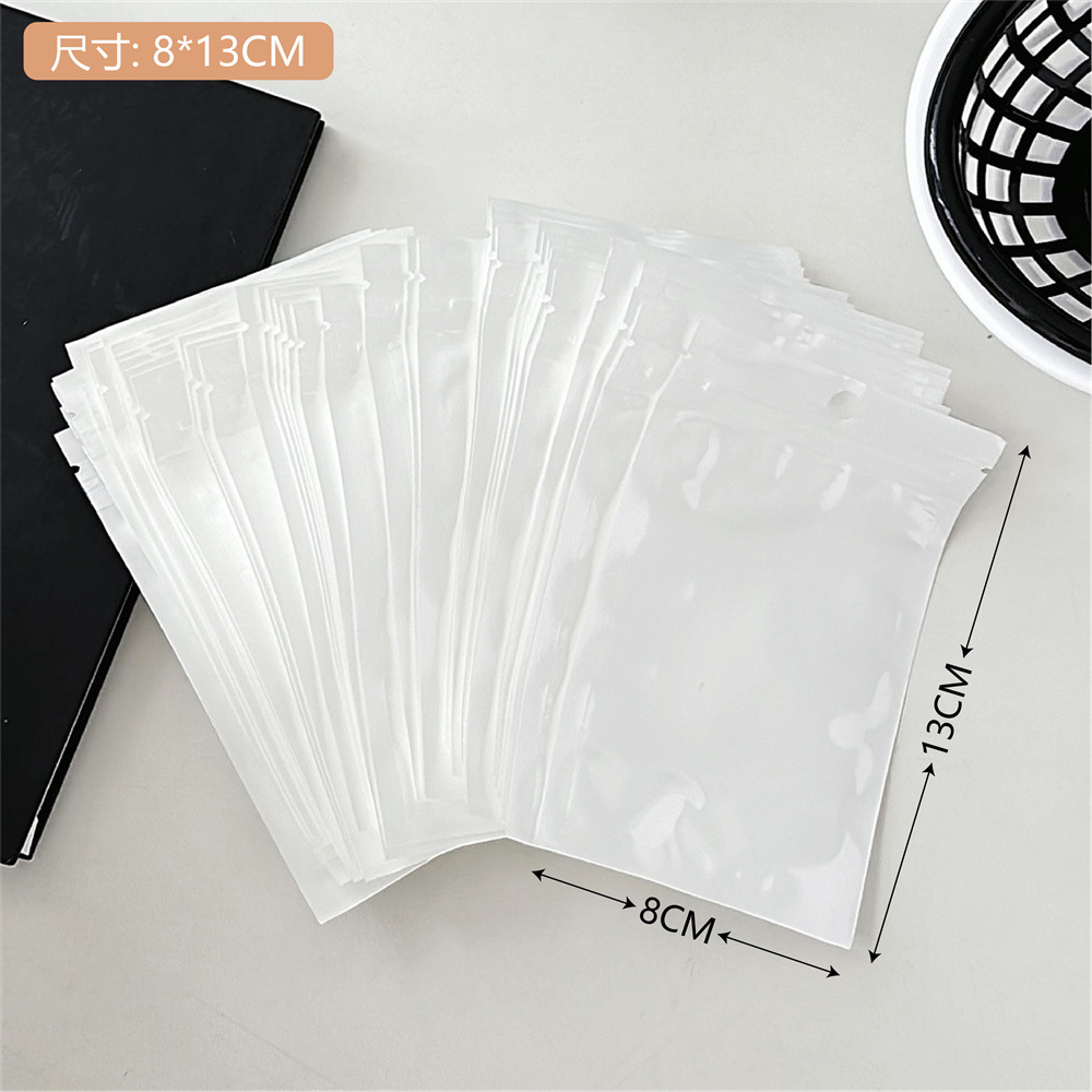 Colección de bolsas opp transparentes, cabeza de tarjeta, bolsa de embalaje trasera, bolsa de joyería pequeña, bolsa autoadhesiva con orificio colgante, bolsa de embalaje de plástico al por mayor