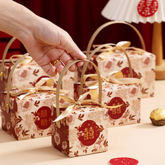 新しい手持ちの喜糖の箱の結婚の喜糖の箱の結婚の贈り物の包みのキャンディーの箱の手の贈り物の箱の喜糖の袋は贈り物の箱に帰ります。
