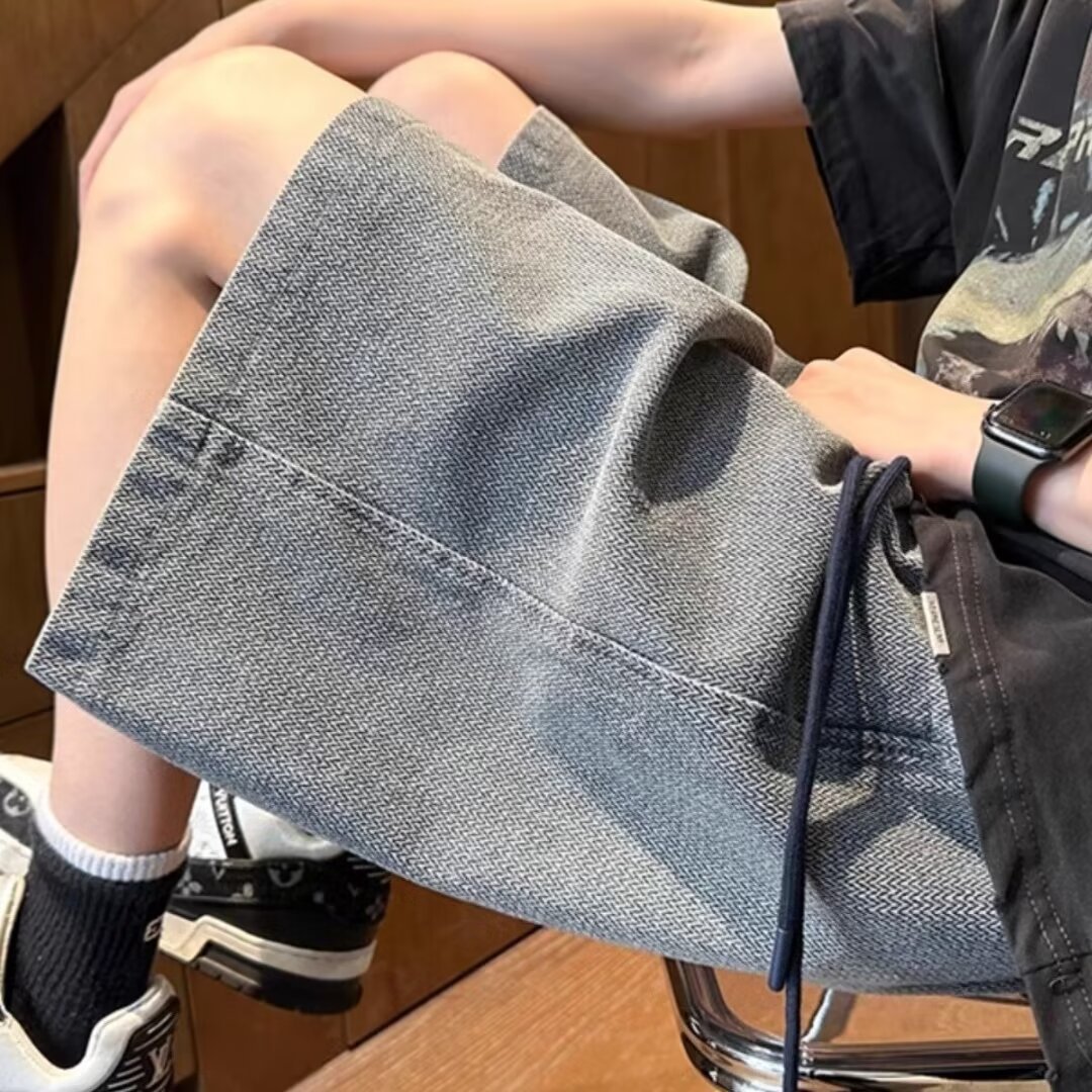 Pantalones casuales cortos de mezclilla de moda lavados, pantalones delgados de verano para hombres, pantalones deportivos rectos de todo fósforo de la calle americana, pantalones de cinco puntos