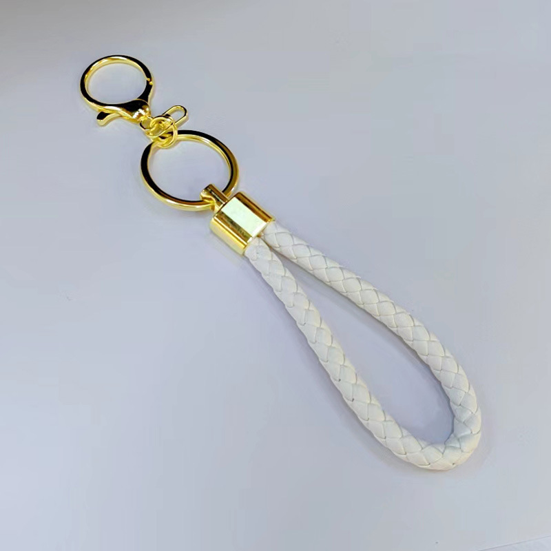 Ronda de la langosta hebilla PU cuero trenzado cuerda llavero hombres y mujeres amor llavero mano cuerda bolsa cordón fábrica directa al por mayor