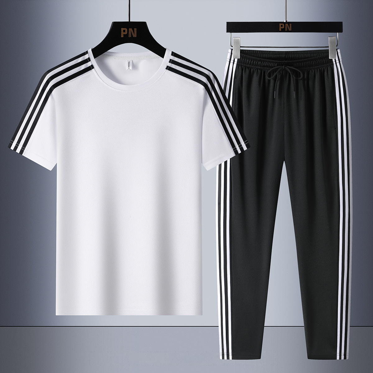Set de tres barras de verano de moda para hombres, mangas cortas transpirables, pantalones casuales rectos para hombres, set de dos piezas.