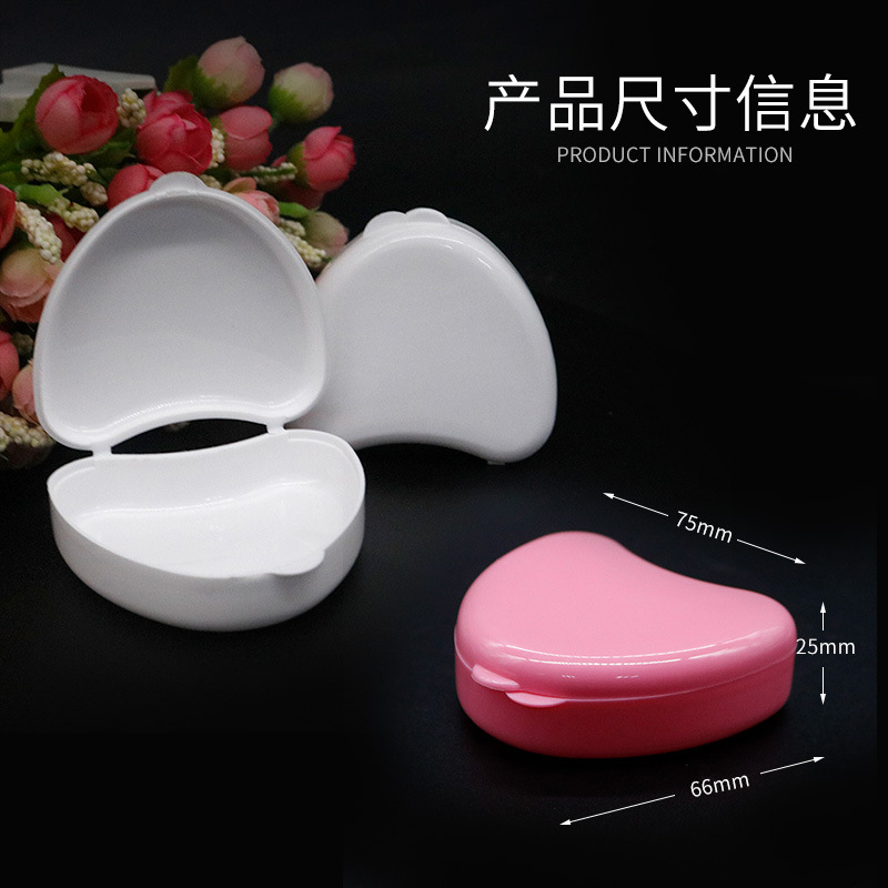 Caja de soporte de diente de plástico colorido caja de soporte de dentadura en forma de corazón caja de soporte de caja de diente pequeño lindo caja de almacenamiento de diente en forma de corazón al por mayor