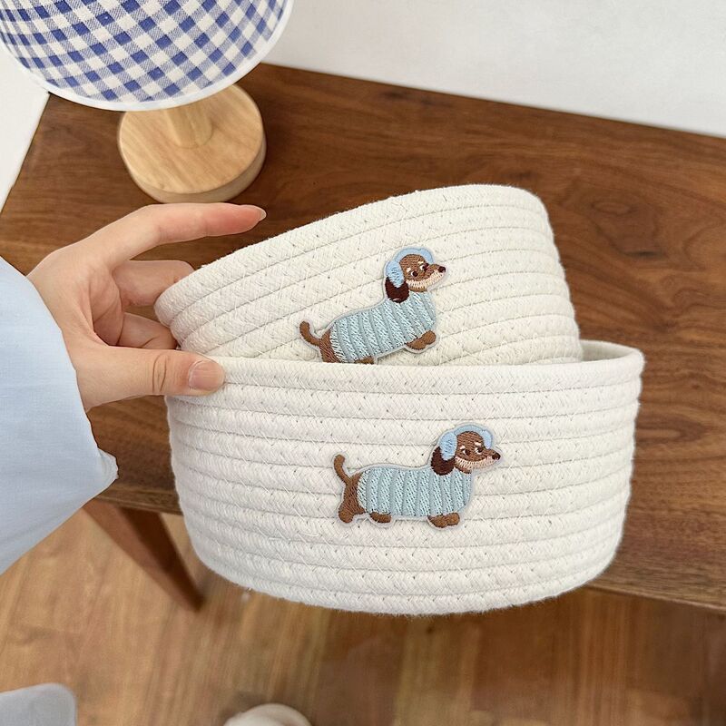 漫画の青いイヤホン犬の綿の線のかごのデスクトップの収納箱はかごの間食のおもちゃの雑物の綿の縄を編んでかごを収納します。|undefined