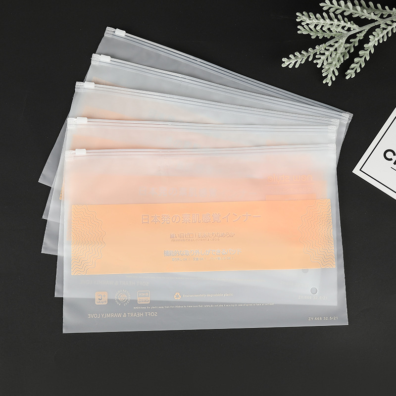 Bolsa con cremallera de ropa Bolsa con cremallera de crisantemo pequeño Bolsa de embalaje de camiseta Bolsa de ropa interior Bolsa de ropa PE esmerilada pequeña bolsa ziplock