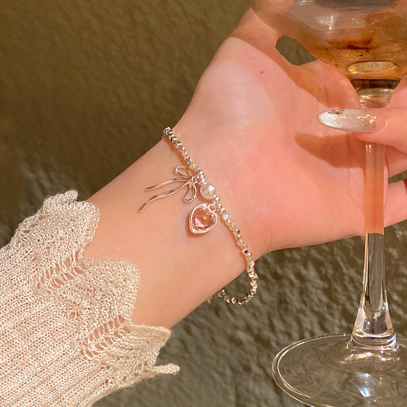 Pulsera de perlas de sentido avanzado de nicho de lujo ligero, temperamento de moda coreano femenino, pulsera de amor de circón intermitente, pulsera de cristal