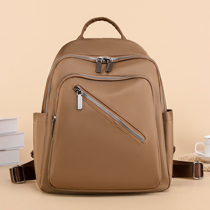 Comercio exterior al por mayor 2023 nueva mochila de nailon casual para mujer, mochila de viaje al aire libre literaria simple, mochila escolar