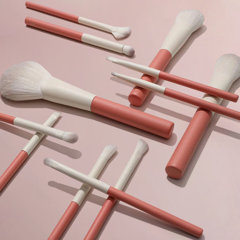 Holiday Series 12 juegos de pinceles de maquillaje Sombra de ojos Corrector Reparación de rubor Cepillo de maquillaje de lana suave de frambuesa