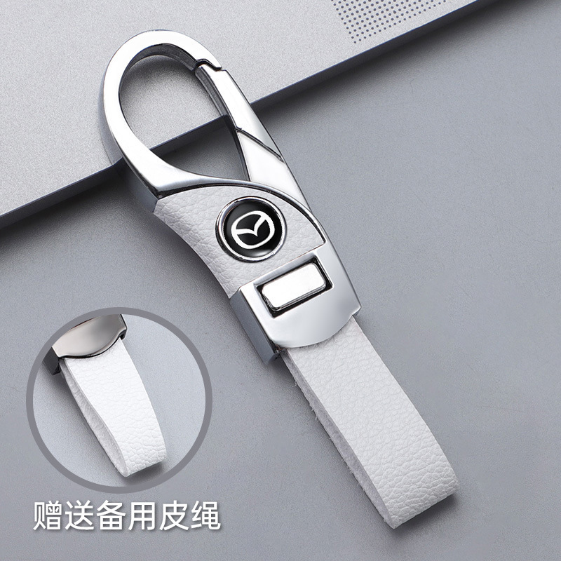 Llavero de automóvil transfronterizo, logotipo del automóvil, cientos de apellidos, botones de cuero de alta gama, colgante de llavero de negocios simple y personalizado