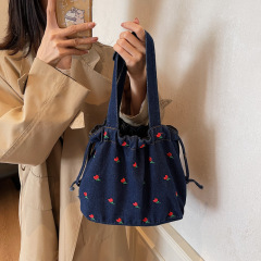 ひも刺繍ファッション文芸レジャー大容量バケツバッグ秋の新型韓国系軽便通勤シングル肩カウボーイ