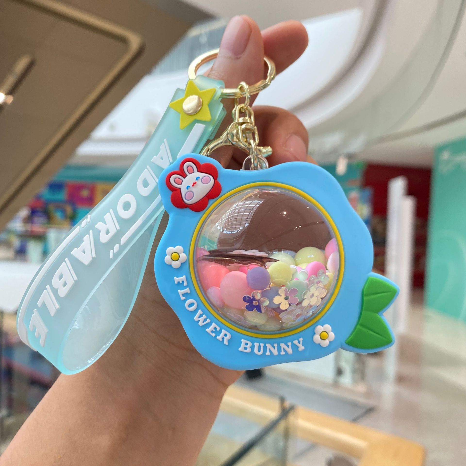 Acrílico lleno de aceite de melocotón llavero pareja bolsa colgante coche llavero lindo pequeño regalo al por mayor