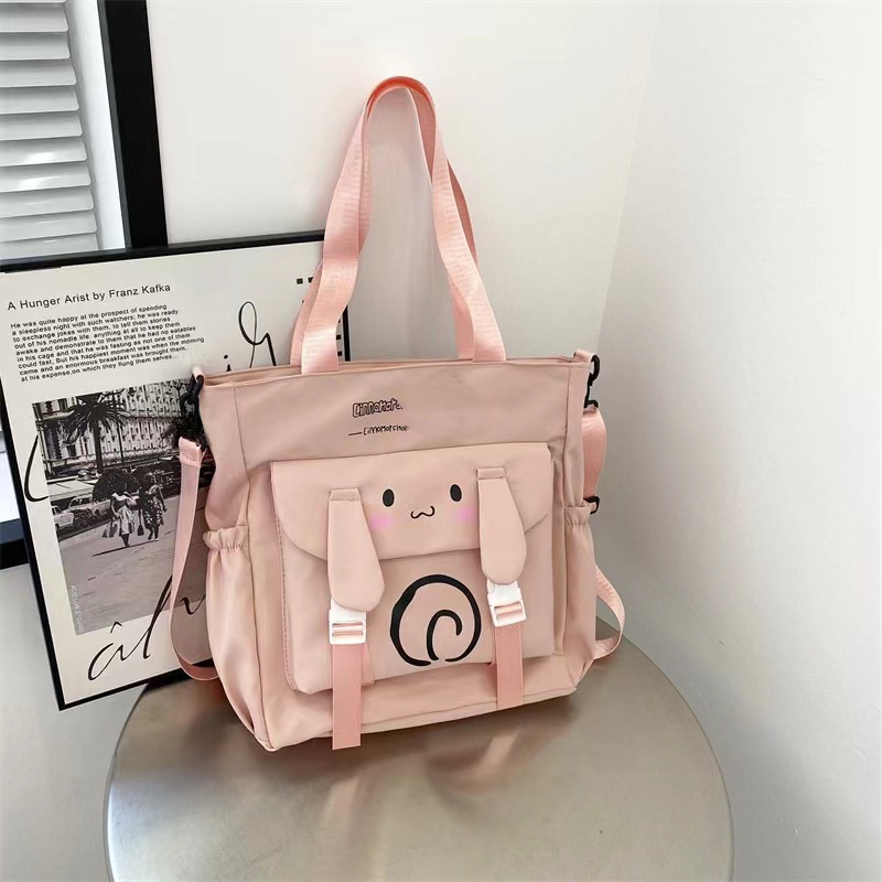 2024 estudiantes bolso de estilo explosivo simple y de gran capacidad nuevo bolso de mensajero de un solo hombro de moda para mujer bolso de viaje