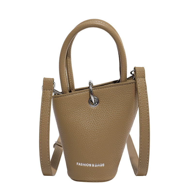 Bolso de cubo de diseño de nicho 2025 verano nuevo bolso de hombro con patrón de lichi mini bolso de mensajero de letras mujer