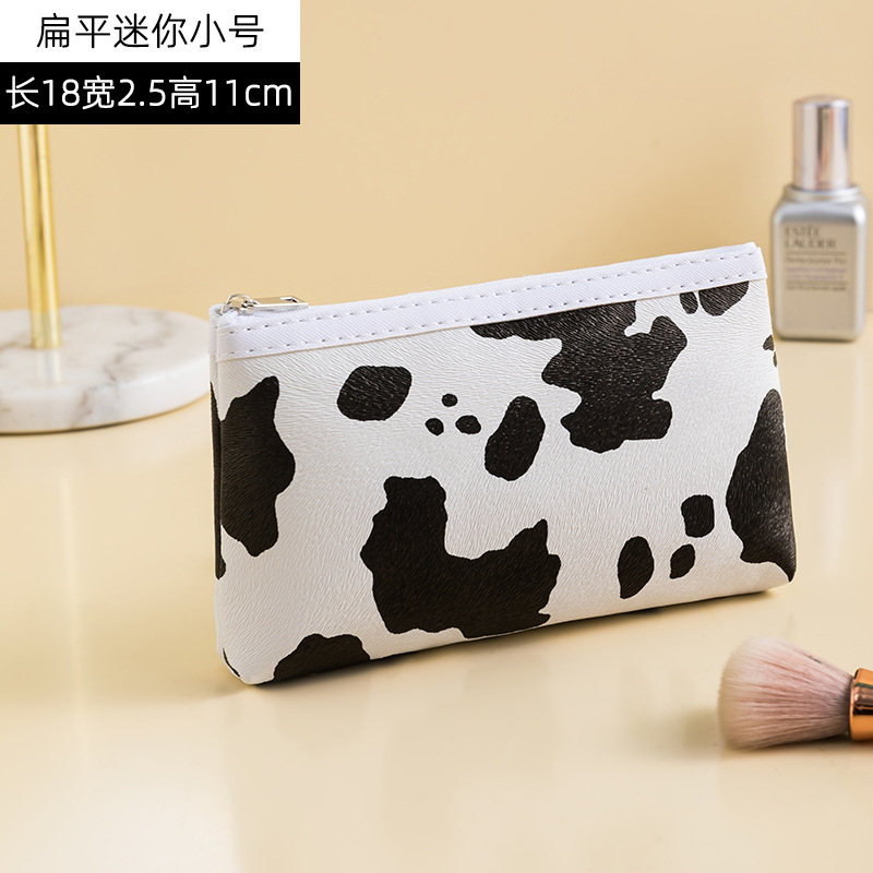 Patrón de vaca PU bolsa de cosméticos impermeable de gran capacidad de alto aspecto portátil avanzado bolsa de almacenamiento cuidado de la piel bolsa de lavado al por mayor