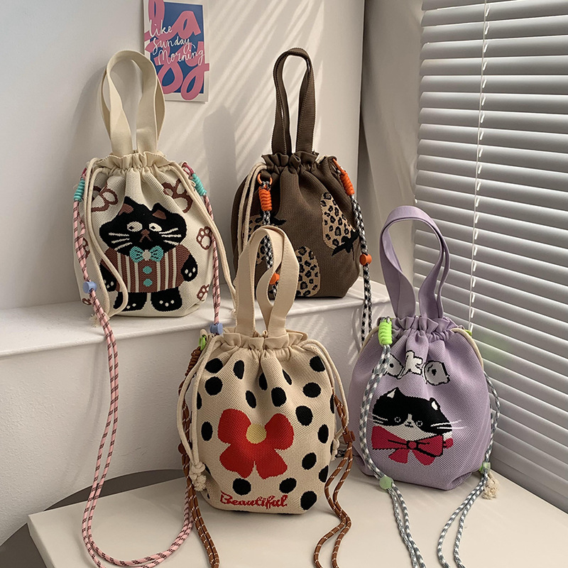 Bolsa de cinturón versátil nuevo patrón de dibujos animados nicho lindo bolso de arroz de almuerzo de cuerda bolso de cubo de mano bolso de brazo