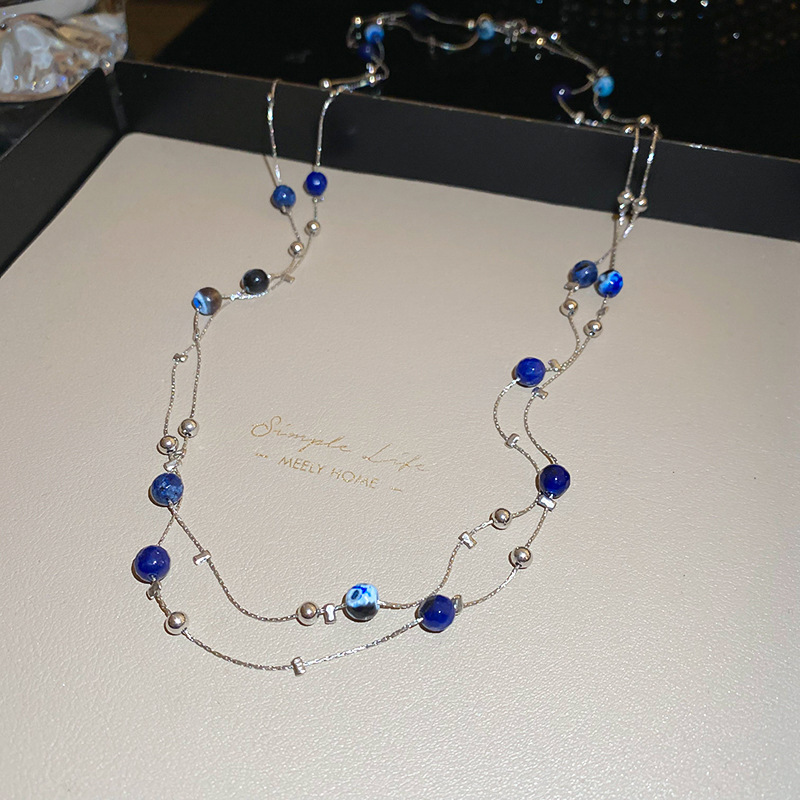 Collar con cuentas de perlas de gota de agua con diamantes transfronterizos otoño e invierno cadena de suéter de lujo ligero francés moda todo fósforo joyería de alta gama