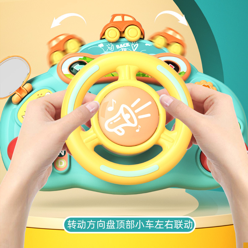 子供のハンドルのおもちゃはシミュレーションして車の後部座席の自動車の赤ちゃんの赤ちゃんの女性の男の子を運転します。
