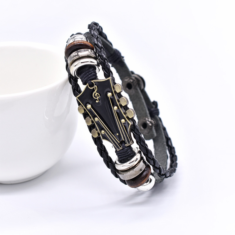 European and American Zinc Alloy Guitar Instrument Leather Bracelet Original Music Four-Button Adjustable Hand-Woven Leather Bracelet European and American Zinc Alloy Guitar Instrument Leather Bracelet Original Music Four-Button Adjustable Hand-Woven Leather Bracelet