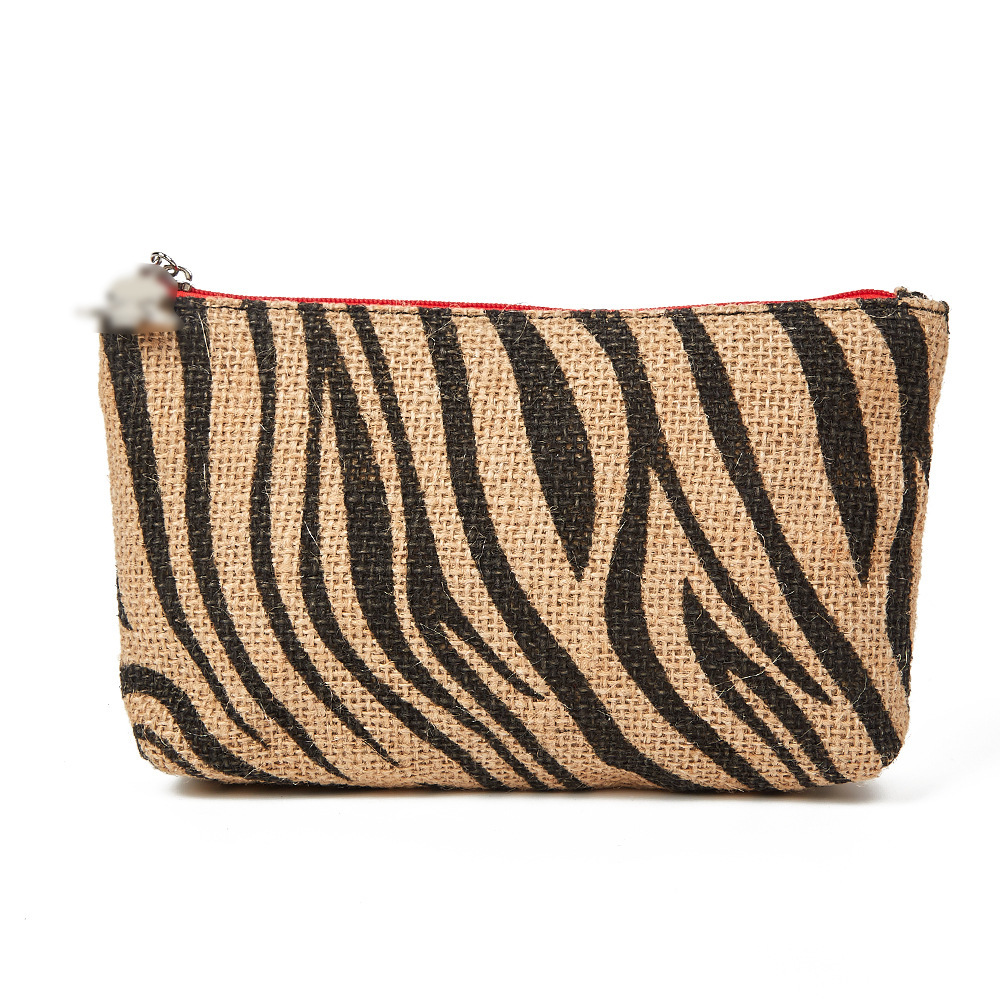 Bolsa de cosméticos al por mayor de fábrica Bolsa de almacenamiento de patrón animal popular transfronterizo Bolsa de embrague de material tejido con logotipo