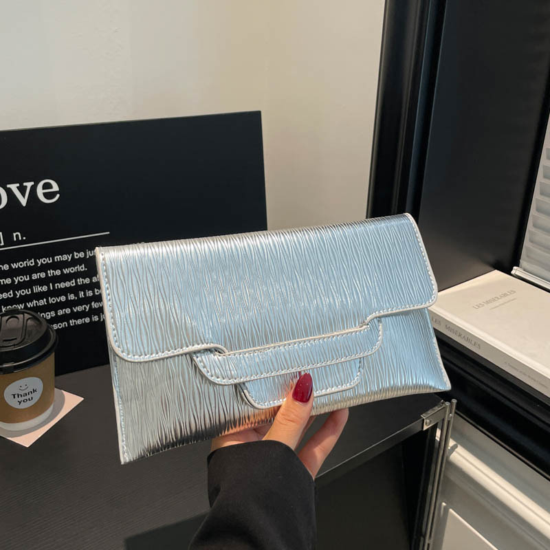 Bolsa de cena de color sólido para mujeres 2026 nueva moda ocio de gran capacidad temperamento personalidad bolso de cambio bolso de mano