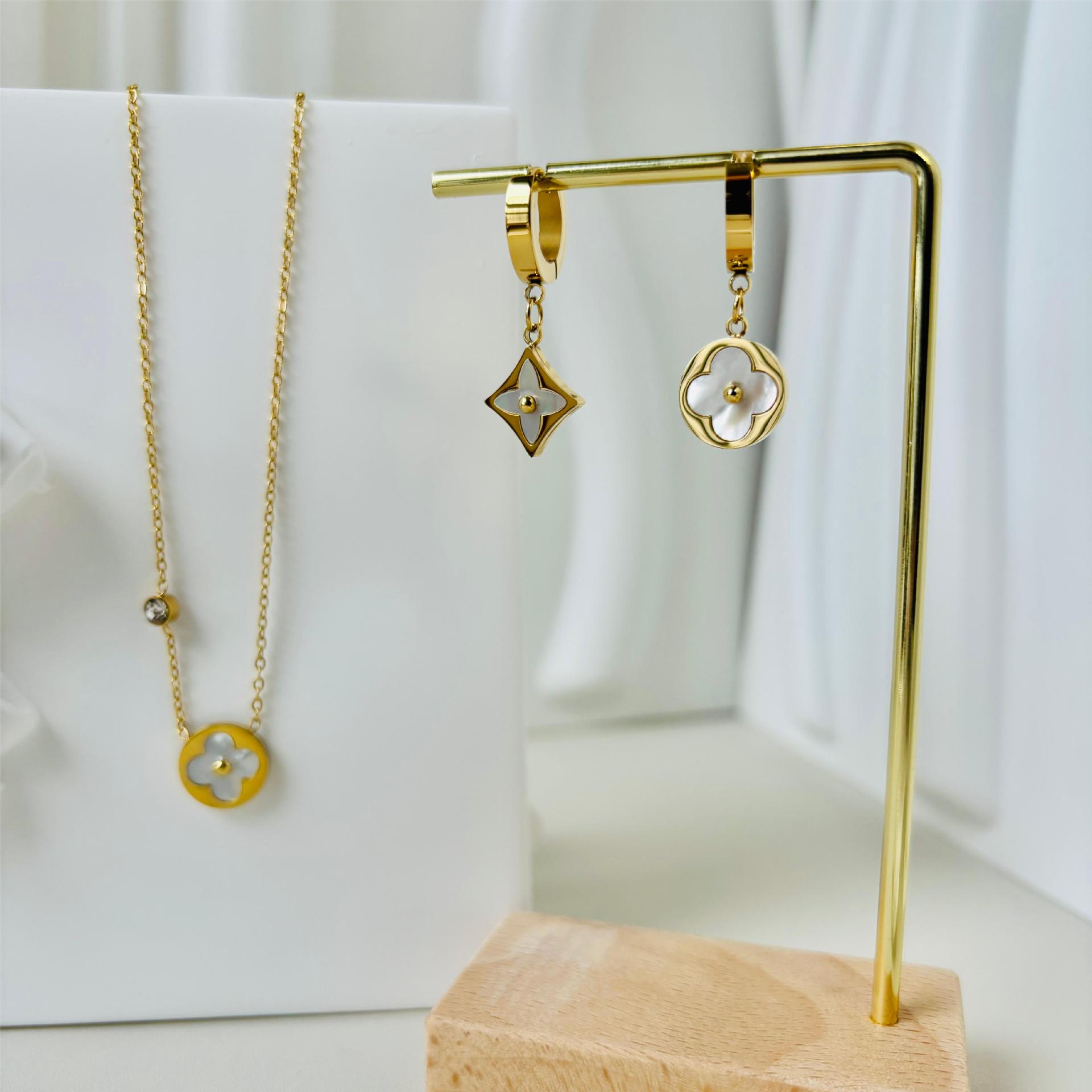 Golden asymmetrical earrings stainless steel