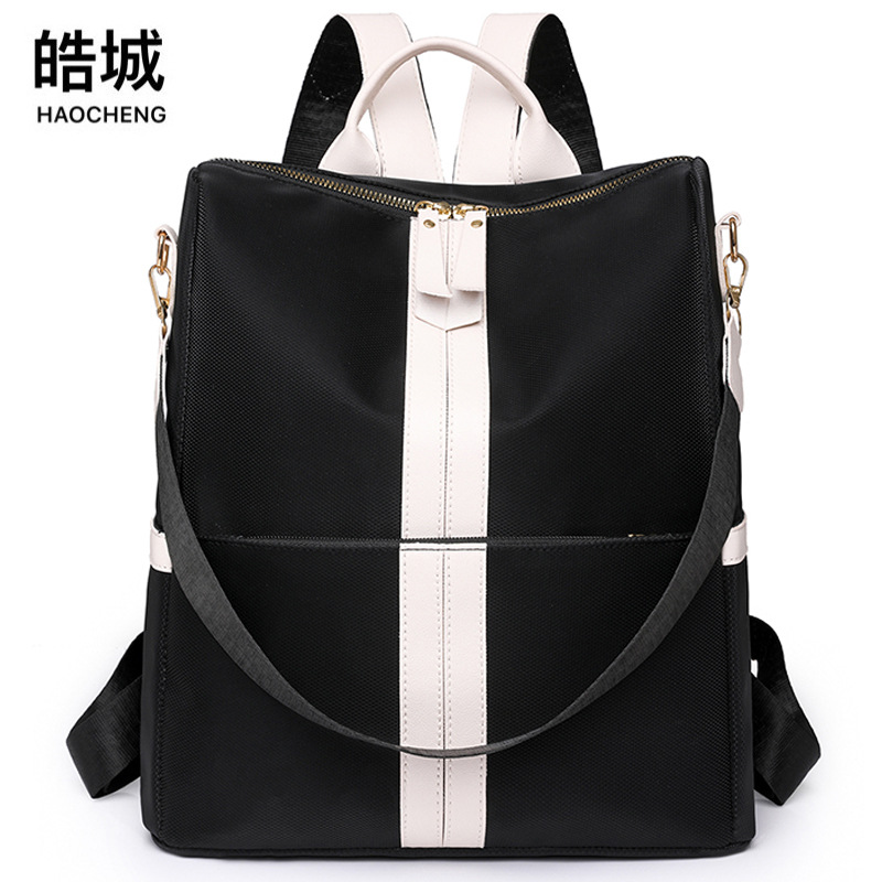 Comercio exterior al por mayor 2023 nuevo estilo casual señoras PU mochila moda contraste color gran capacidad mochila de viaje de doble uso marea