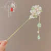 Golden Chinese hairpin white jade with tassels, orchid