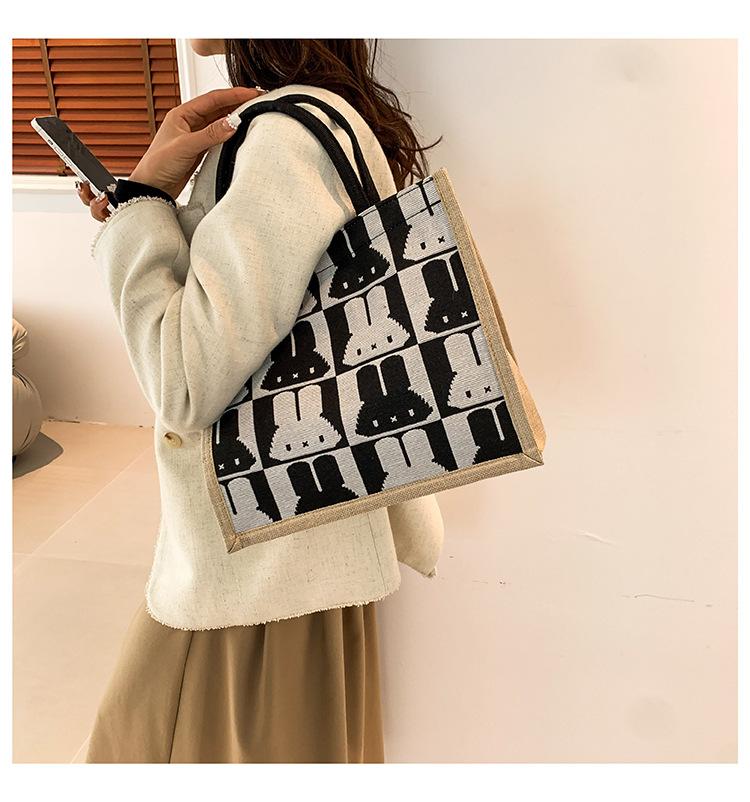 High-end mid-capacity canvas school commuting handbag 2024 new style fashionable and versatile linen single-shoulder tote bag undefined