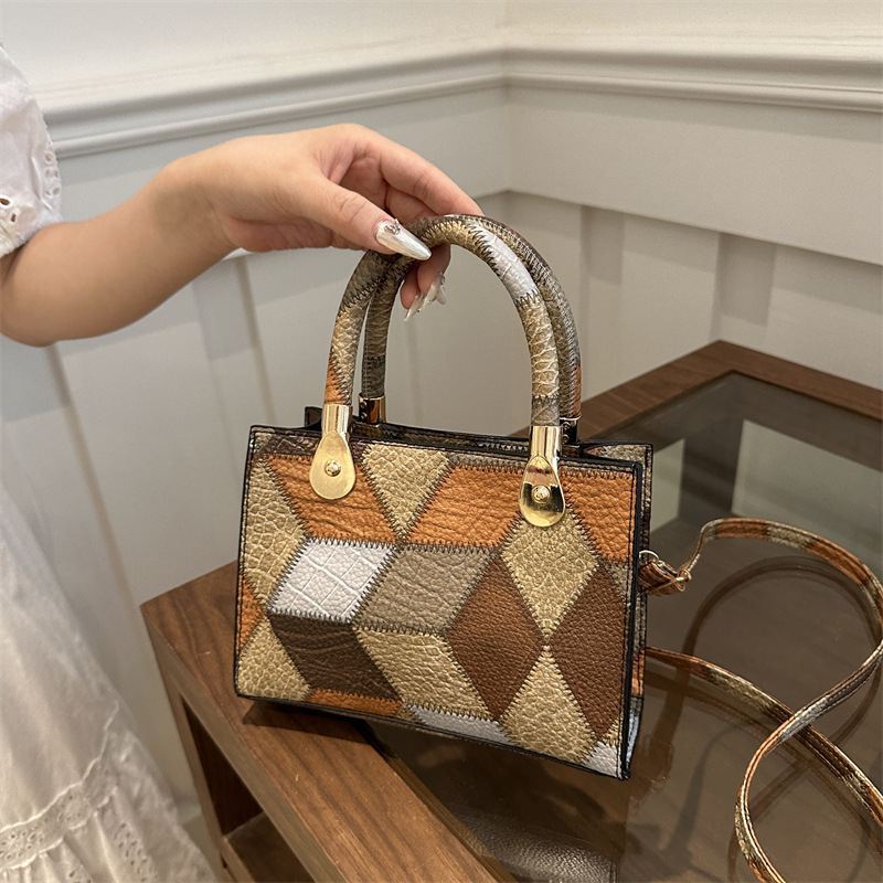 Nueva bolsa de hombro de mujer simple empalme de moda de gran capacidad bolsa de mano PU cuero suave sensación casual portátil ligero