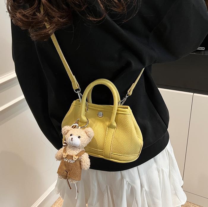 Bolsa de cubo de mano popular de verano para mujeres 2025 nuevo bolso de hombro super caliente universal nicho super caliente mochila