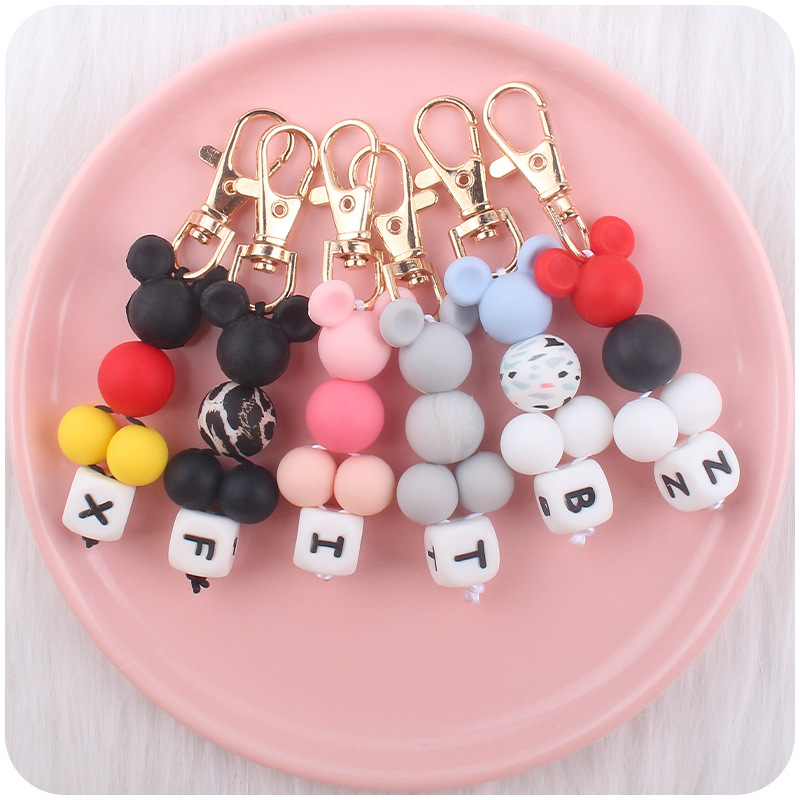 Creativo DIY nueva historieta cuentas pequeño colgante contraste color silicona cuentas llavero colgante bolsa pequeño colgante AliExpress