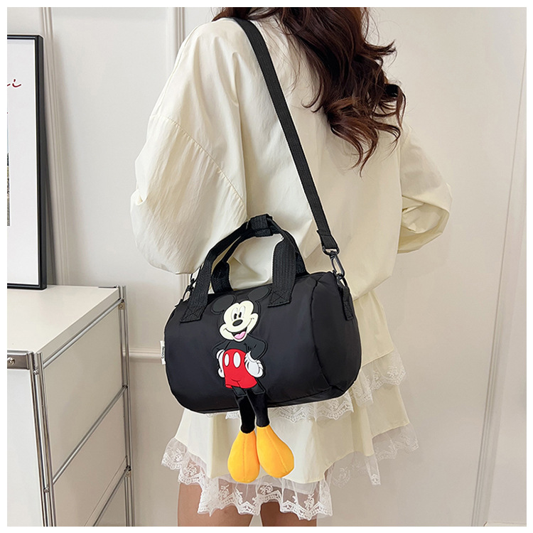 The 2021 new children's bags feature a cute Mickey Mouse pattern bowling bag for girls and a fashionable hand-held shoulder bag undefined