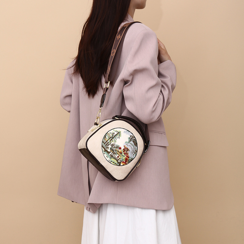 Transfronterizos ocio de cuero suave bolsas redondas versátiles exquisitas retro bolsas de hombro inclinadas de gran capacidad nuevas bolsas de mamá chinas