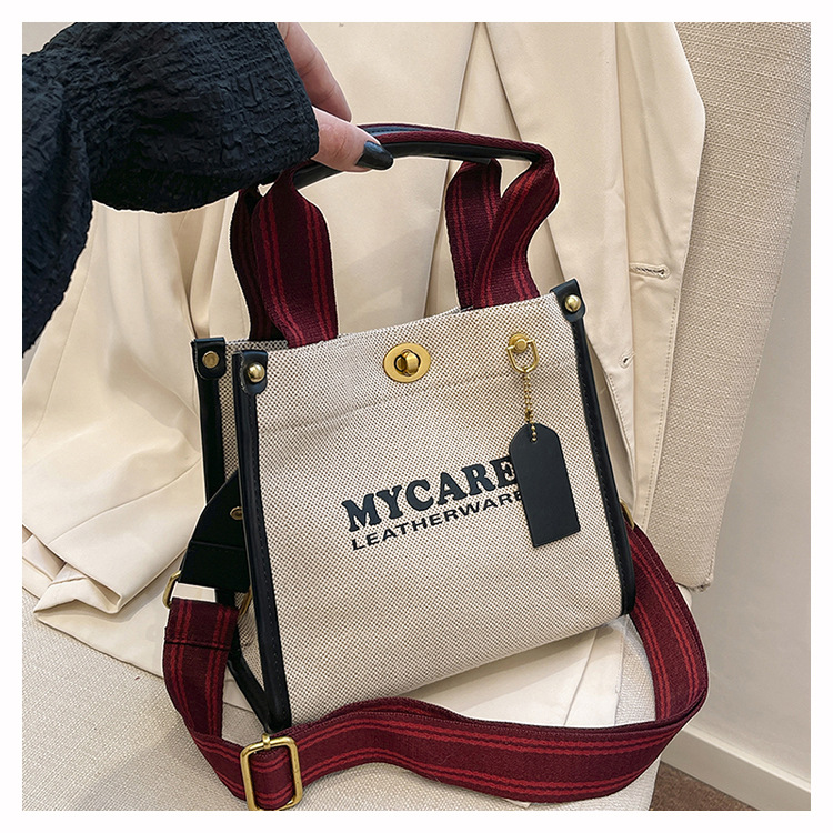 Bolsa de mano de lona de gran capacidad para mujeres 2024 nueva moda impresa letras mochilas bolsa de viaje casual