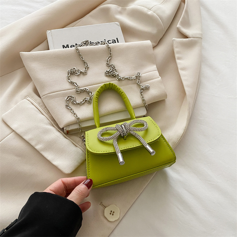 Bowknot Fashion versión coreana de estilo occidental pequeño bolso cuadrado bolso femenino 2025 verano nuevo bolso de cadena de viaje salvaje mujer