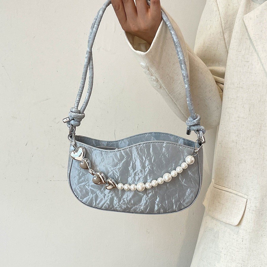 Textura de celebridades de Internet, bolso pequeño de estilo occidental para mujer 2024 verano nuevo bolso de hombro de perlas, bolso de axila de mensajero de moda de todo fósforo