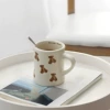Off-white waist‑shaped bear mug