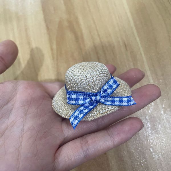 small woven plush toy with bow