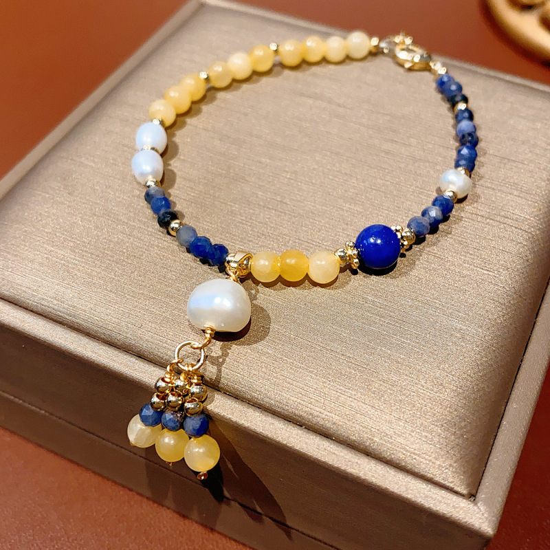 Pulsera de granate de ojo de tigre de cristal natural, nueva pulsera de todo fósforo de estilo nacional de estilo chino, joyería de novia de alta gama de lujo ligero
