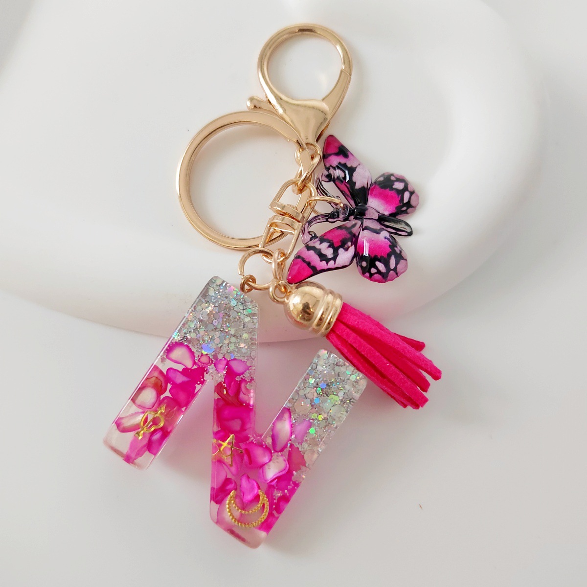 Inventario transfronterizo nueva resina bicolor mariposa borda llavero colgante estrella luna accesorios de joyas