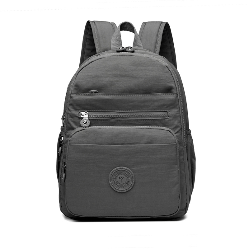 Mochila de hombro de comercio exterior 2025, nueva mochila de computadora simple de color sólido, mochila de escuela secundaria, mochila para hombres y mujeres.