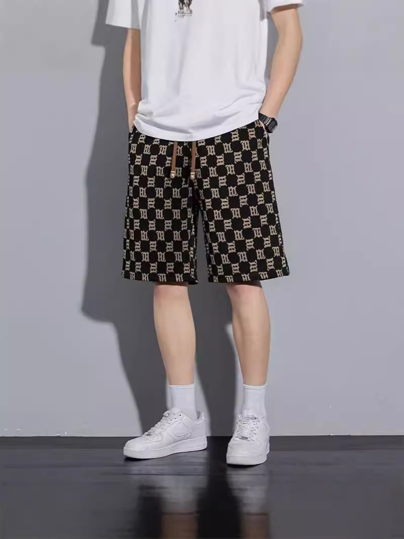 Camisas de ropa de seda de hielo delgada pantalones cortos casuales sueltos de verano estilo de Hong Kong pantalones de playa de hombre de moda pantalones casuales