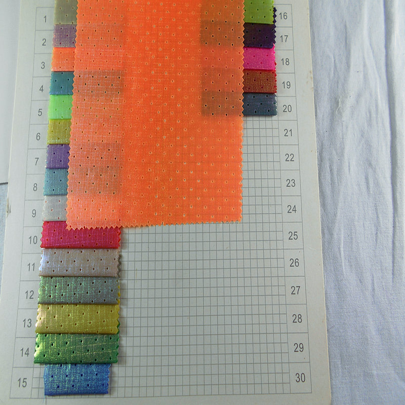 尼龙涤纶风衣离型纸珠光布 穿孔冲孔棉服羽绒服夹克风衣服装面料