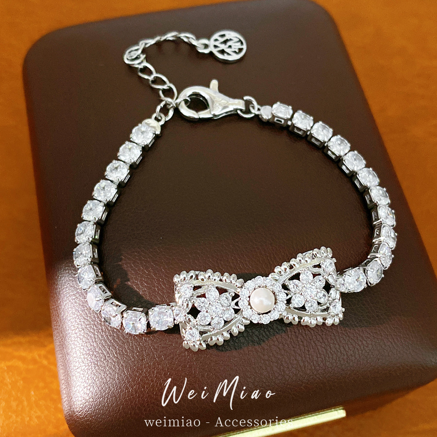 Zircon plata perla pulsera arco pulsera de moda coreana dulce y fresco pulsera de lujo ligera alta sensación de joyas de mano versátiles mujeres