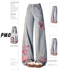 気品刺繍の水洗いジーパンの女性の春のファッションの洋風の蝶はズボンのデザイン感の毛の縁の広い足のズボンをつなぎ合わせます。