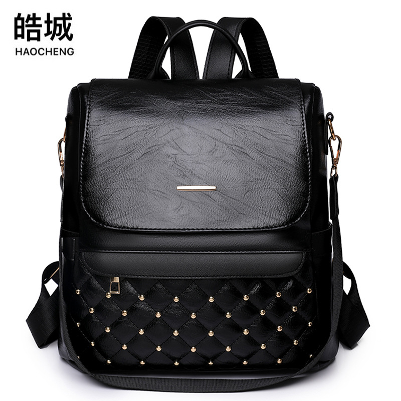 2023 primavera nuevo estilo casual damas remache cuero suave mochila de viaje multifuncional de un solo hombro con hilo de bordar de moda