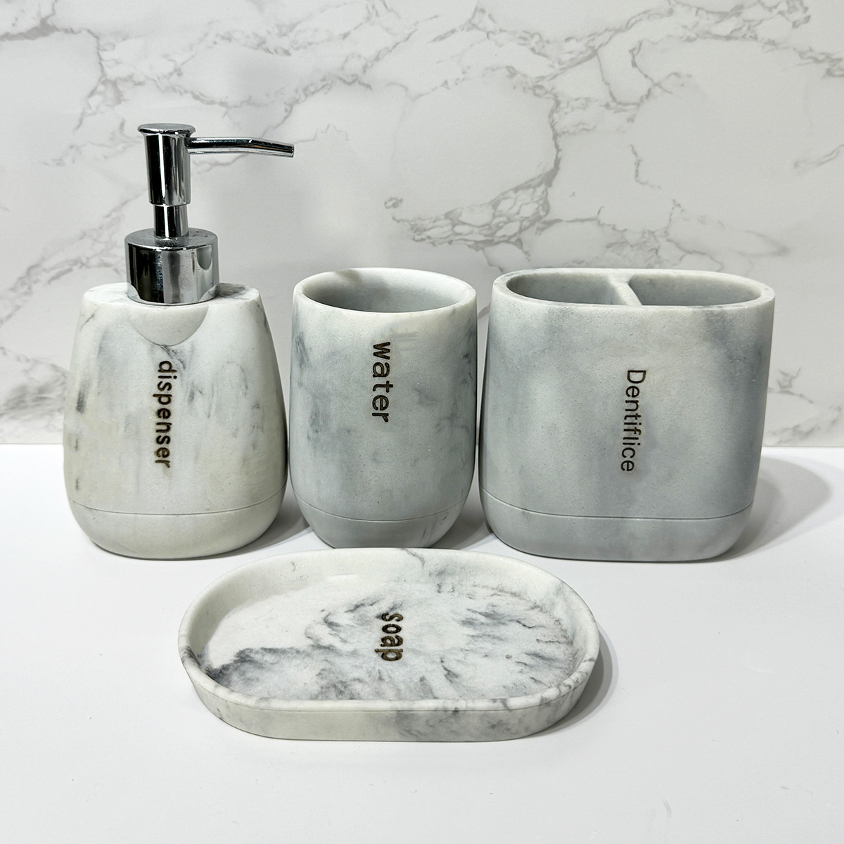 Baño para el hogar moderno Juego de cuatro piezas de resina de mármol Juego de lavado de baño Decoración de baño Botella de loción