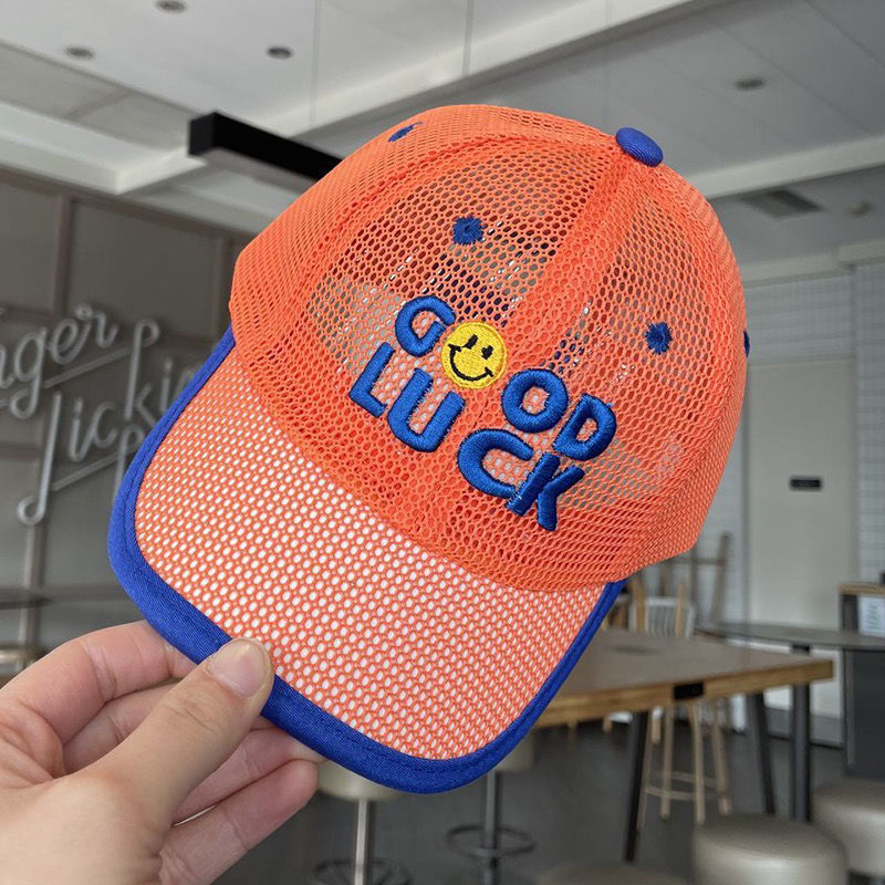 Orange tape, baseball cap